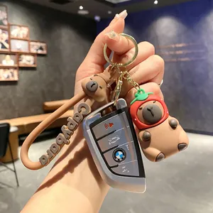 Adorable 3D Capybara animal keychain with a brown wrist strap and gold ring for car keys