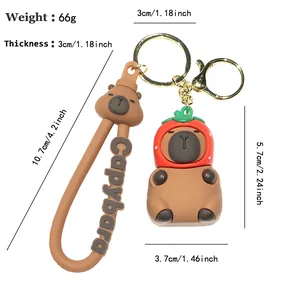 Cute 3D Capybara keychain featuring strawberry hat and wrist strap, 66g weight.