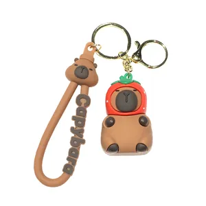 Cute 3D Capybara keychain with strawberry hat and soft rubber strap for bags and keys