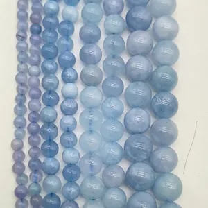 Macro view of lavender amethyst and aquamarine round loose beads in various sizes