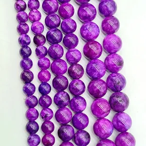 Macro view of high-quality polished lavender amethyst round beads with natural patterns