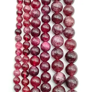 Close-up macro view of natural lavender amethyst round loose beads in various sizes and shades