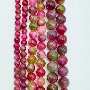 Detailed macro view of vibrant multi-color gemstone round beads for custom jewelry making