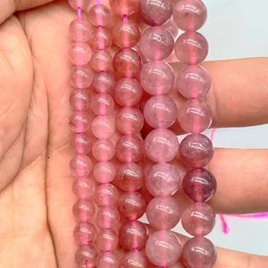 Close-up detail of translucent lavender amethyst round loose beads for jewelry making