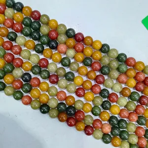 Macro detail view of multi-colored round polished stone beads for DIY jewelry making