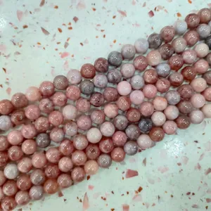 Close-up detail of polished lavender amethyst round beads for jewelry making