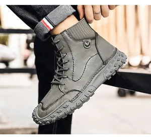 Side view of grey high-top men's casual boots with textured leather and thick lug sole