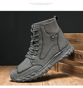 Detailed view of grey men's high-top boots with rugged EVA sole and textured leather upper.