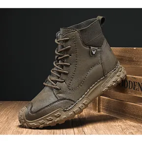 Close-up of durable brown high-top men's boots with lug sole and knit collar detail