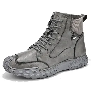 Trendy grey high-top men's boots with textured leather and rugged rubber soles.