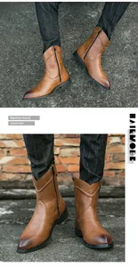 Détail de bottes de cowboy en cuir marron pour hommes avec bout pointu et fermeture éclair