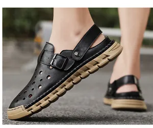 Close-up of men's black breathable closed-toe sandals with chunky tan sole
