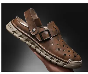 Close-up of men's brown leather hollow-out beach sandals with adjustable buckle strap.
