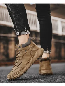 Brown high-top leather Martin boots for men featuring a durable non-slip studded rubber sole.