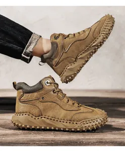 Side view of rugged men's high-top leather Martin boots featuring a spiked rubber sole