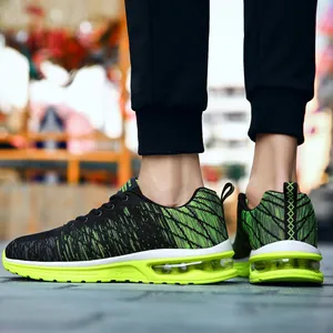 Chaussures de sport respirantes pour hommes noir et vert fluo avec semelle à coussin d'air
