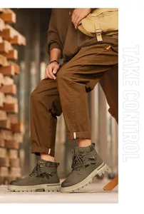 Close-up detail of men's olive green high-top work boots with camouflage accents