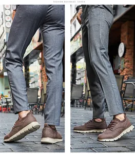 Detailansicht der braunen Brogue-Freizeitschuhe für Herren mit grauer Hose in der Stadt