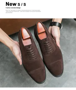 Close-up of premium brown suede cap-toe oxfords featuring a sleek minimalist design