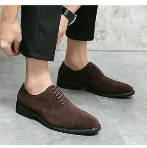 Close-up of men's dark brown suede cap-toe oxford shoes in a formal business style.