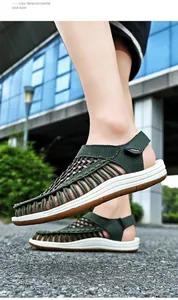 Detailed side view of green hand-woven men's sandals with adjustable Velcro heel strap