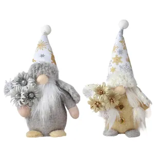 Decorative standing Christmas gnomes set in gold and silver colors for festive desktop ornaments