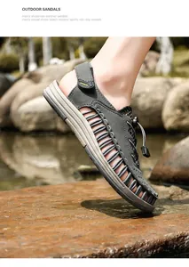 Close-up detail view of grey woven rope men's outdoor sandals on a river rock background