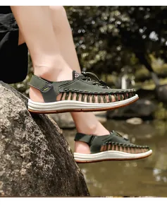 Close-up of men's olive green woven cord sandals being worn in an outdoor nature setting