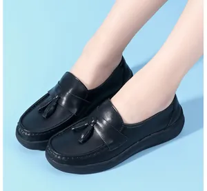 Close-up of black nurse shoes with stylish tassels and comfortable thick soft soles