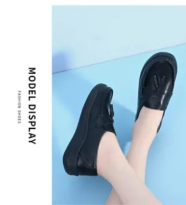 Close-up view of black leather tassel loafers with breathable thick soles for nursing work