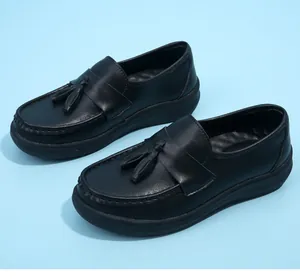 Classic black women's nurse loafers with tassel detail and comfortable wedge sole