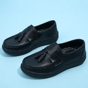 Women's black loafer nurse shoes with tassel detail and soft thick sole