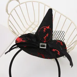 Close-up detail of a Halloween witch hat headband featuring red bat patterns and mesh bow