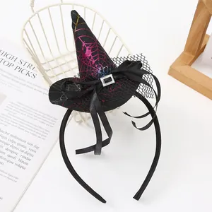 Detailed view of Halloween witch hat headband with metallic spider web pattern and bow.