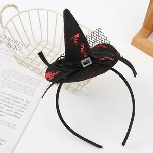Detail shot of a Halloween witch hat headband featuring black mesh and red patterns