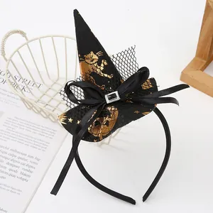 Detail view of Halloween witch hat headband with golden cat patterns and black bow