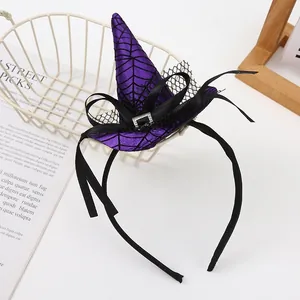 Detail view of a purple Halloween witch hat headband featuring a classic spider web pattern.