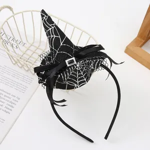 Detailed view of Halloween witch hat headband featuring silver spider web pattern and lace