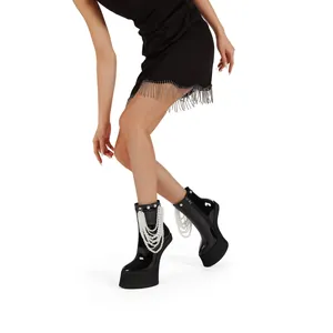 Stylish black patent leather platform ankle boots featuring chic pearl chain details