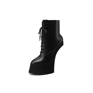 Distinctive black heelless platform ankle boots featuring a tall lace-up front design.