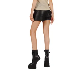 Detailed view of women's black leather platform no-heel boots with front laces