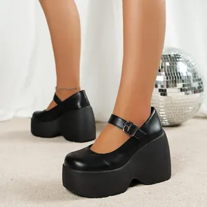 Detailed view of black retro platform Mary Jane shoes with thick wedge sole on model