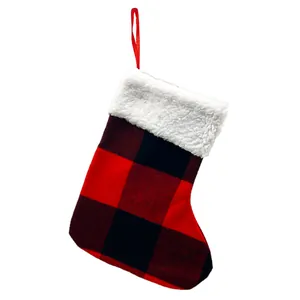 Red and black buffalo plaid Christmas stocking with white faux fur cuff and loop