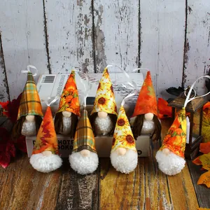 Handmade autumn harvest festival gnome ornaments with sunflower and plaid hats