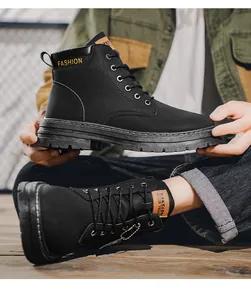 Close-up detail of black men's Martin boots with lace-up design and durable rubber sole.