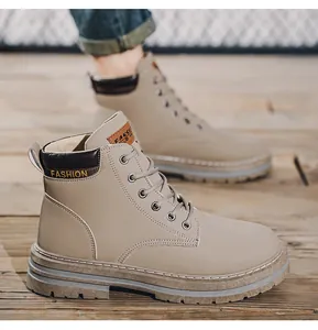Close-up detail of durable khaki men's lace-up Martin boots for outdoor hiking trips