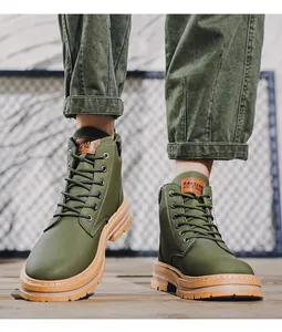 Front view of olive green men's outdoor tactical boots with durable rubber soles.