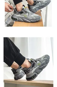 Vista dettagliata del design in mesh grigio e delle suole spesse di queste sneaker chunky da uomo.