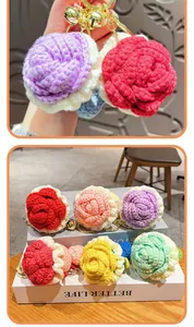 Detailed view of colorful handmade crochet rose keychains with gold bells and rings