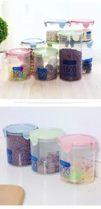 Detail of various sizes of transparent plastic food storage jars with colorful lids